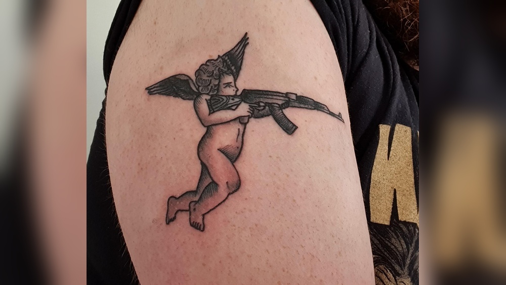 angel with ak 47 tattoo meaning jpg