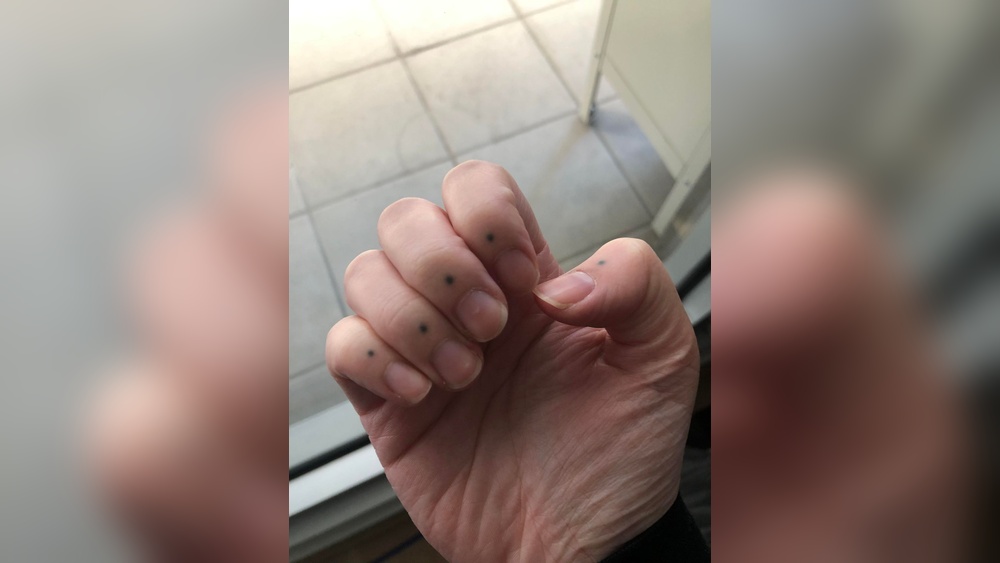 dots on fingers tattoo meaning jpg