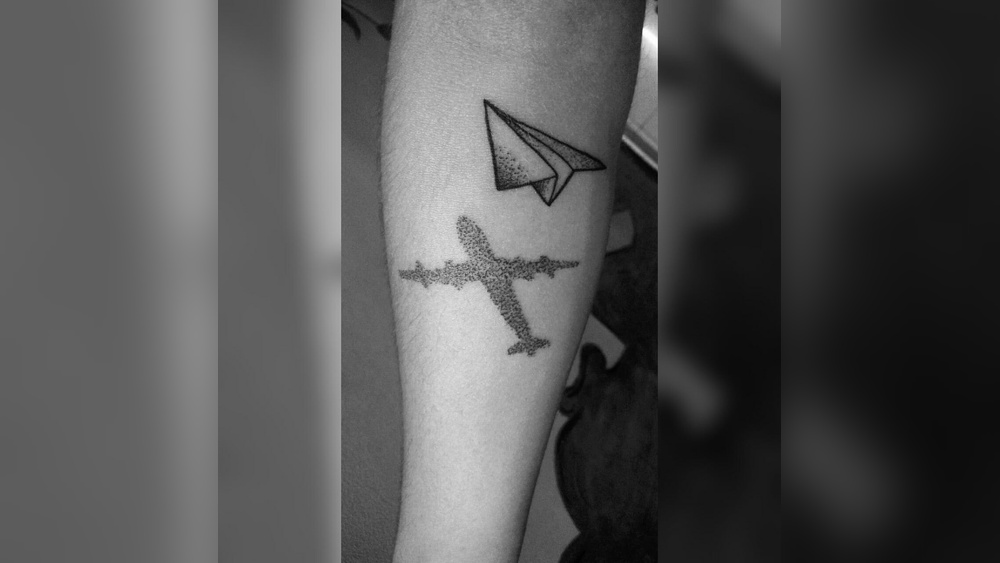 paper plane tattoo meaning.jpg