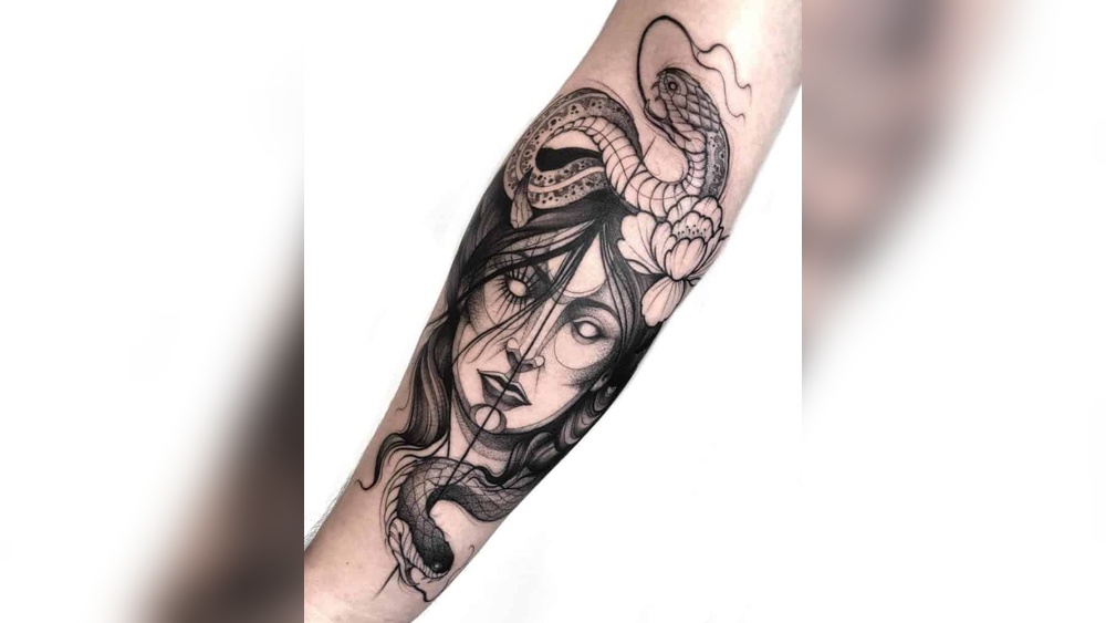 snake tattoo meaning on a woman.jpg