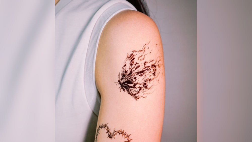 butterfly on fire tattoo meaning jpg